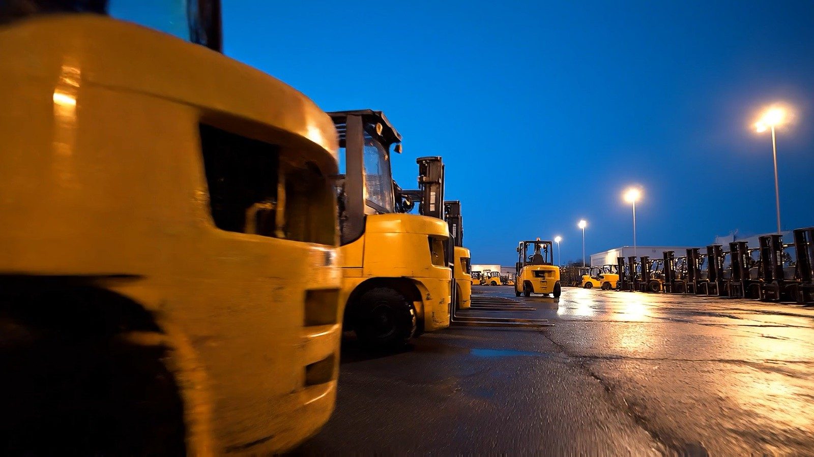 A fleet of forklifts in a distribution yard